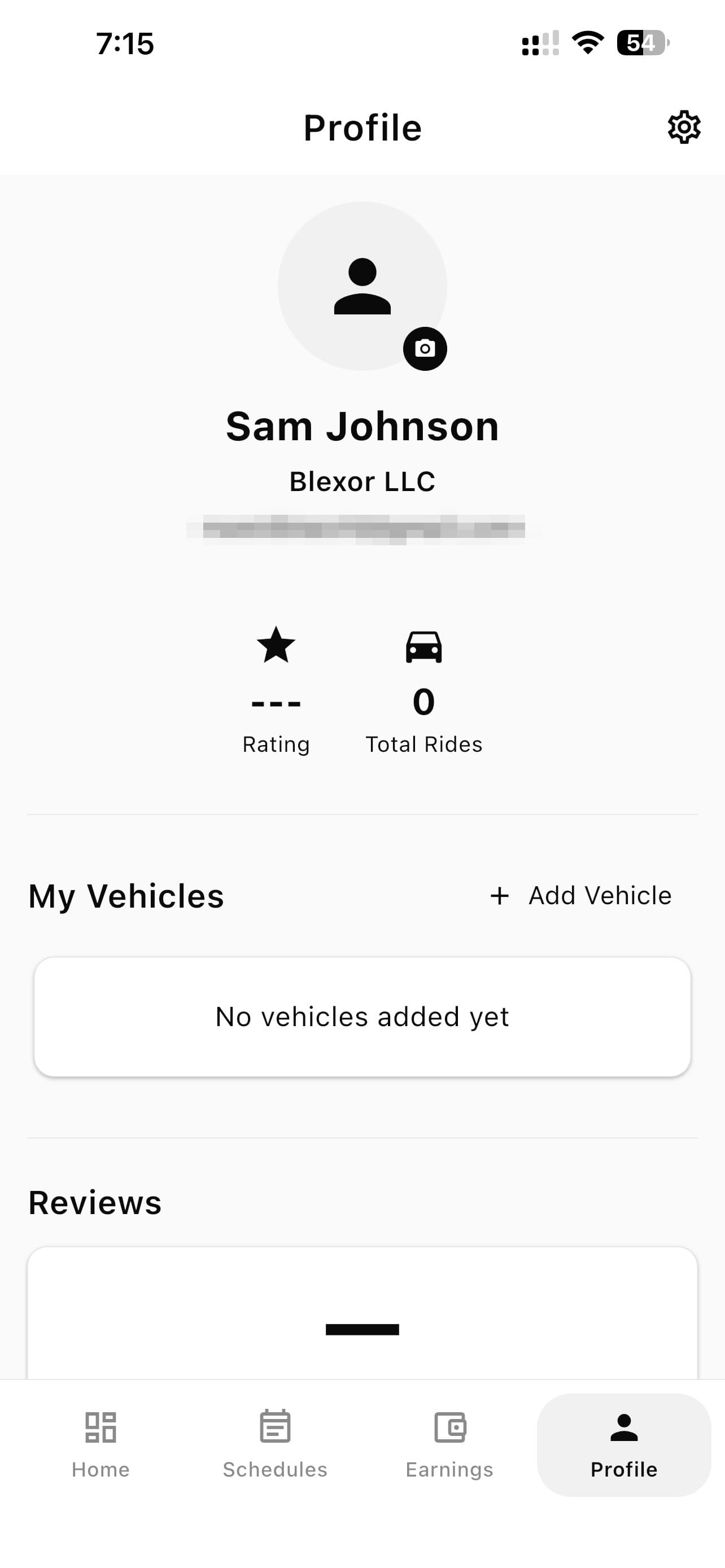 The driver Profile tab, with the camera button on the avatar and the Add Vehicle link.