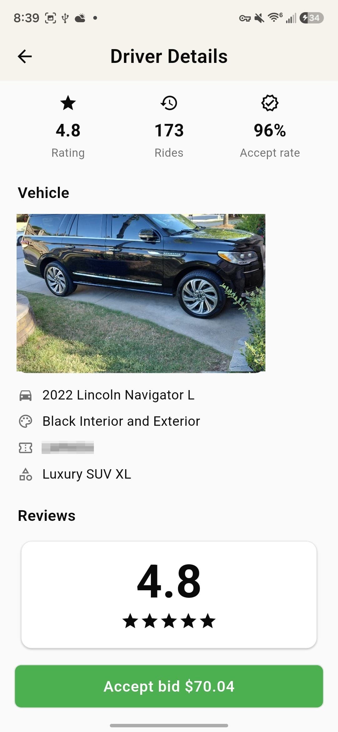 A driver's details before accepting their bid — rating, rides completed and the vehicle.